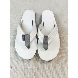Rainbow flip flops.